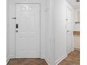 Apartment entry with white door, tile floor, and coat closet at 1501 Clairmont Rd # 223, Decatur, GA 30033