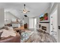 Spacious living room with fireplace and hardwood floors at 418 Kenley Ct, Mcdonough, GA 30253