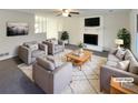 Virtually staged living room featuring fireplace and ample seating at 4620 Cedar Brook Se Dr, Conyers, GA 30094
