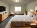 Virtually staged main bedroom with large bed and sitting area at 4620 Cedar Brook Se Dr, Conyers, GA 30094