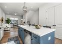 Bright open floor plan with a kitchen island, stainless appliances and hardwood flooring at 720 Perch Pl, Atlanta, GA 30312
