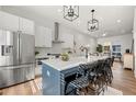 Well-lit, modern kitchen featuring stainless steel appliances and a center island with barstool seating at 720 Perch Pl, Atlanta, GA 30312