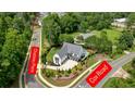 Aerial view of property at Chateau Place and Cox Road, surrounded by lush greenery at 100 Chateau Pl, Woodstock, GA 30188