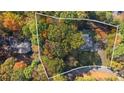 Aerial view of the property highlighting mature trees and the home's setting at 4070 Whitewater Creek Nw Rd, Atlanta, GA 30327