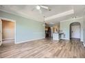 Bright living room open to kitchen with modern flooring, ceiling fan and plenty of space at 4333 Dunwoody Park Dr # 3406, Dunwoody, GA 30338