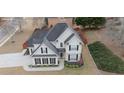 Aerial view of home with manicured lawn, dark roof, and fenced backyard at 100 Cottonwood Pl, Stockbridge, GA 30281