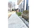 Charming home exterior with window boxes and walkway at 100 Cottonwood Pl, Stockbridge, GA 30281