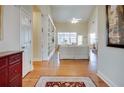 Inviting entryway with hardwood floors leading to a bright, spacious living room at 3710 Blackgold Dr, Buford, GA 30519