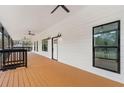 Spacious front porch with ceiling fans and wooden flooring at 4280 Atlanta St, Powder Springs, GA 30127