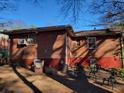 Brick home's rear view, showing a small patio and yard at 2369 Springdale Sw Rd, Atlanta, GA 30315