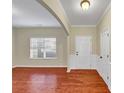 Bright living room featuring elegant floors, neutral walls, and large window at 275 Creek View Ln, Acworth, GA 30102