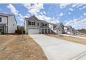 Beautiful two-story home boasting light gray siding and a spacious driveway at 339 Garnet Dr, Acworth, GA 30101