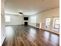 Spacious living room with hardwood floors, fireplace, and natural light at 339 Garnet Dr, Acworth, GA 30101