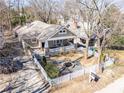 An aerial view of a charming craftsman-style home with a welcoming front porch and a lovely front yard with a fountain at 536 Moreland Ne Ave, Atlanta, GA 30307