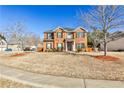 Charming two-story brick home with a well-manicured front yard at 5447 Stirrup Way, Powder Springs, GA 30127