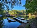 Tranquil lakefront property with private docks at 3720 Riviera Dr, Cumming, GA 30041