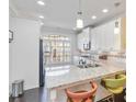 Modern kitchen with white cabinets, granite counters, and stainless steel appliances at 104 Laurel Crest Aly, Johns Creek, GA 30024