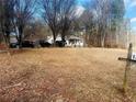 Exterior view of home and front yard showing driveway, landscaping, and mailbox at 1381 Allgood Rd, Marietta, GA 30062