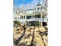 Charming two-story home with an inviting wrap-around porch, perfect for relaxing outdoors at 2610 Woodridge Chase, Canton, GA 30114