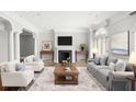 Living room with fireplace, large windows, and neutral decor at 2960 S Pharr Nw Ct # N2, Atlanta, GA 30305