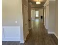 Hardwood floors and neutral-toned walls in the hallway at 3019 Fairway Dr, Villa Rica, GA 30180