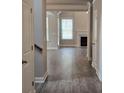 Open-concept living room showcasing a fireplace, wood floors and natural light at 3019 Fairway Dr, Villa Rica, GA 30180
