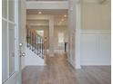 Bright and spacious entryway with hardwood floors and a staircase at 26 Homesite Cooper E Cv, Fayetteville, GA 30214