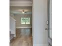 Hardwood floor entryway with view into living room at 4341 Portsbrook Ave, Snellville, GA 30039
