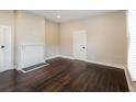 Simple bedroom with dark hardwood floors and neutral walls at 1847 New Ne St, Conyers, GA 30012