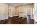 Spacious living room with hardwood floors and fireplace at 1847 New Ne St, Conyers, GA 30012