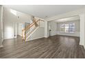 Spacious living room with hardwood floors and staircase at 3072 Elmendorf Nw Ln, Kennesaw, GA 30144