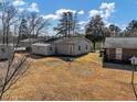View of the backyard with sheds at 1891 Highway 81 E, Mcdonough, GA 30252