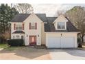 Inviting two-story home with a two-car garage, red shutters, and a classic architectural design at 59 Pompas Ct, Dallas, GA 30157