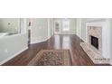 Inviting living room featuring hardwood floors, a brick fireplace, and views of the backyard at 1165 Hardin Bridge Rd, Euharlee, GA 30145