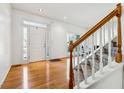 Spacious entryway with hardwood floors and access to the stairs and backyard at 1464 Oglethorpe Dr, Suwanee, GA 30024