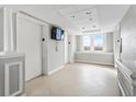 Elevator lobby area with tiled floors and a window with a city view at 2479 Peachtree Ne Rd # 605, Atlanta, GA 30305