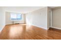 Spacious living room area with hardwood floors and plenty of natural light at 2479 Peachtree Ne Rd # 605, Atlanta, GA 30305