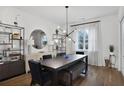 Bright dining room featuring hardwood floors, modern lighting, and stylish décor at 3667 Peachtree Ne Rd # 16, Atlanta, GA 30319