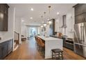 Modern kitchen features a large island with seating, stainless steel appliances, and stylish pendant lighting at 3667 Peachtree Ne Rd # 16, Atlanta, GA 30319