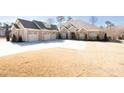 Brick house with a four-car garage and expansive lawn at 2195 Morgan Ne Rd, Marietta, GA 30066