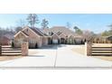 Brick house with a large driveway and three-car garage at 2195 Morgan Ne Rd, Marietta, GA 30066