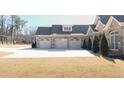 Three-car garage with light-beige doors at 2195 Morgan Ne Rd, Marietta, GA 30066