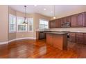 Spacious kitchen with hardwood floors, an island, and stainless steel appliances at 2969 Rivergreen Se Ln, Atlanta, GA 30339