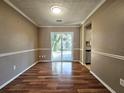 Simple dining area with hardwood floors and sliding glass door at 3140 Shadow Walk Ln, Tucker, GA 30084
