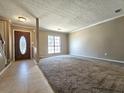 Bright living room with tile and carpet flooring at 3140 Shadow Walk Ln, Tucker, GA 30084
