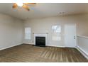 Spacious living room with fireplace and carpet flooring at 5010 Mundy Dr, Cumming, GA 30028