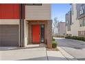 Modern townhome featuring a bold red front door and attached garage at 504 Rankin Ne St # 4, Atlanta, GA 30308