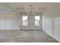Spacious dining room with hardwood floors and chandelier at 142 Buffalo Trce, Stockbridge, GA 30281