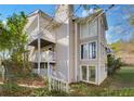 Multi-level building with a wooden deck and stairs at 2006 Augusta Se Dr, Marietta, GA 30067