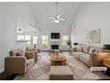 Virtually staged living room with vaulted ceiling, fireplace, and ample natural light at 60 Legend Creek Holw, Douglasville, GA 30134